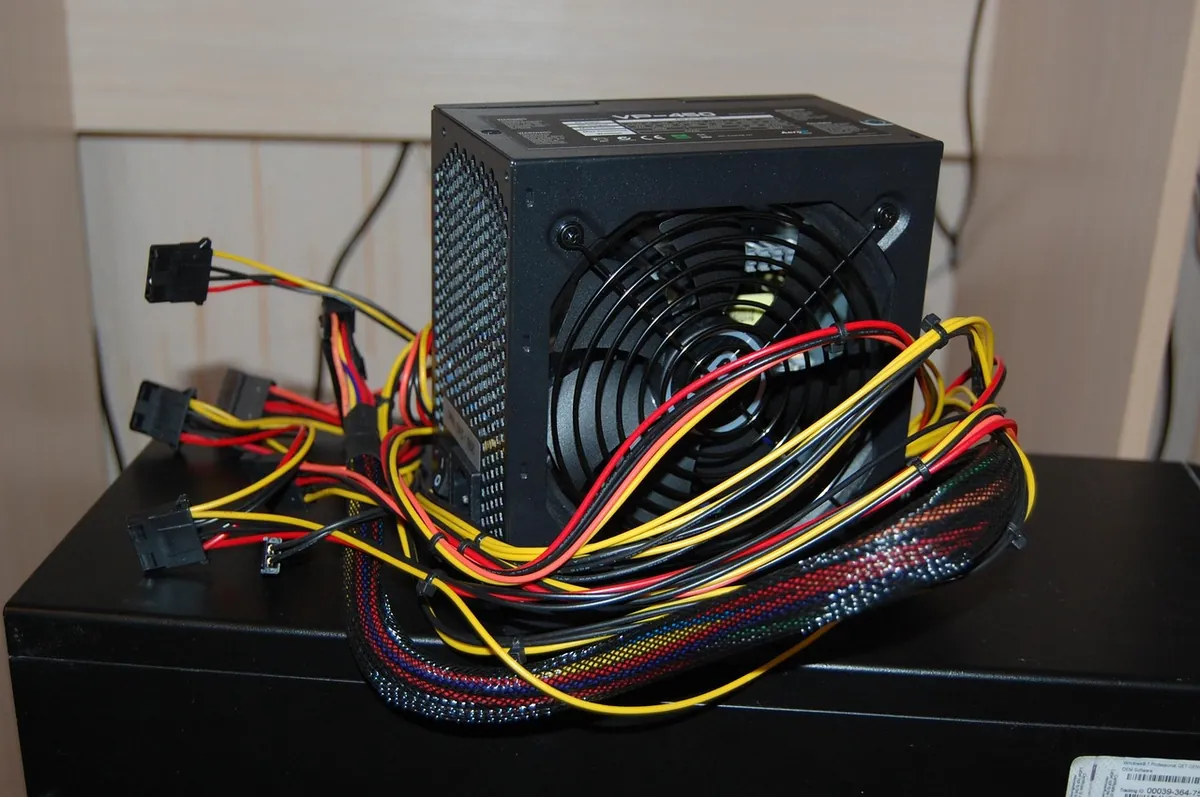 PC power supply unit with cable connectors and cooling fan
